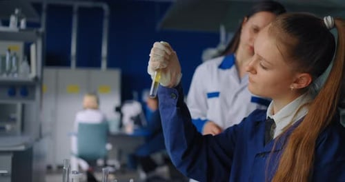 Scientific Laboratory In University Female Professor And Student Girl Doing Experiments Innovation
