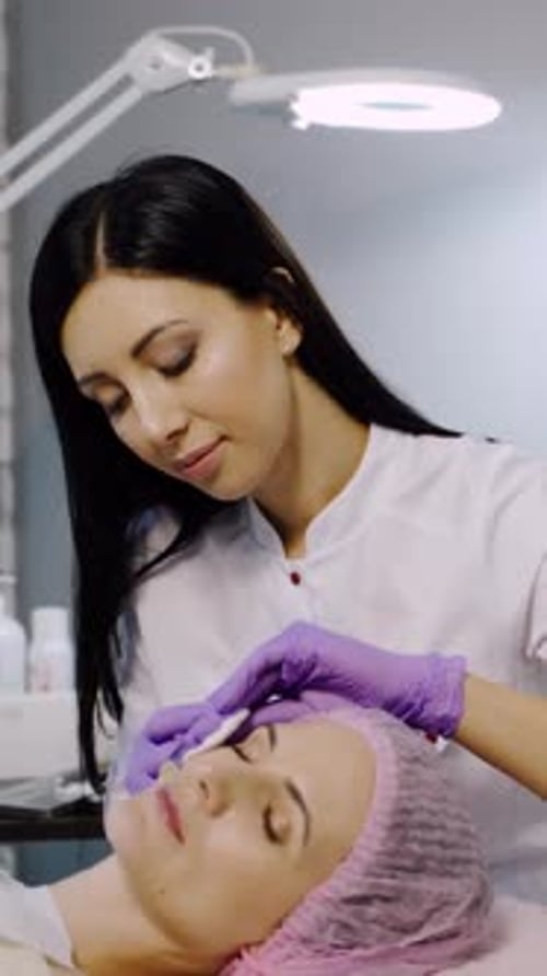 Rejuvenating facial injections. Modern cosmetology. Vertical video