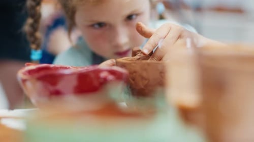 Girl Learns Pottery and Shapes the Clay in the Pottery Workshop During Masterclass