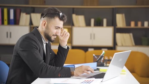 Man Working At Desk In Modern Office