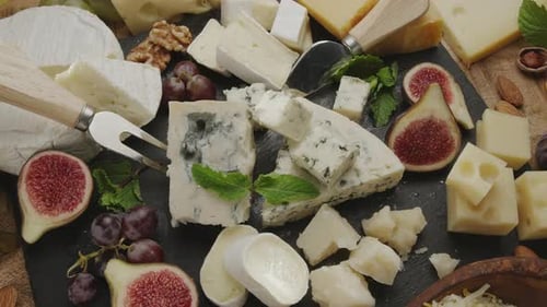 Cheese Selection with Grapes and Figs Close Up