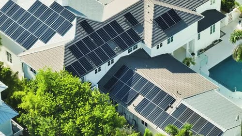 Aerial View of Big Expensive American Building Roof with Blue Solar Photovoltaic Panels for