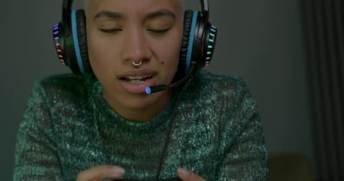 Focused Gamer Plays Video Games Indoors