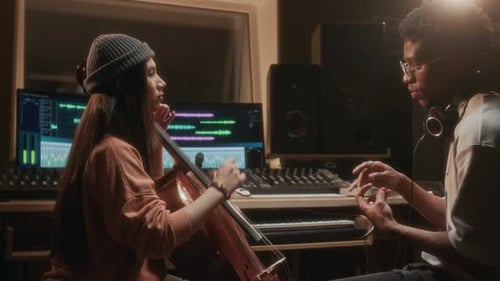 Musicians collaborate in warm music studio