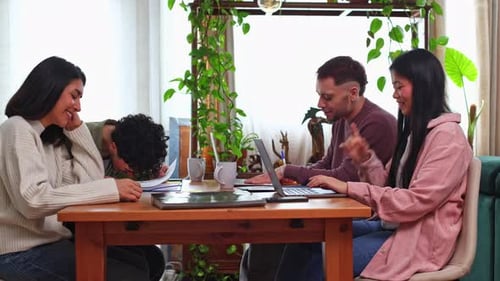 Young Coworkers Collaborating on a Creative Project in an Office