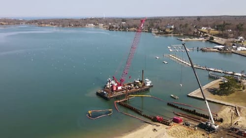Aerial Timelapse of Tug Boat manoeuvring Crane on the water. Drone Static