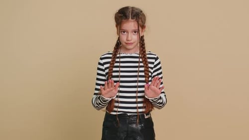 Girl Making Stop Gesture in Mid Shot