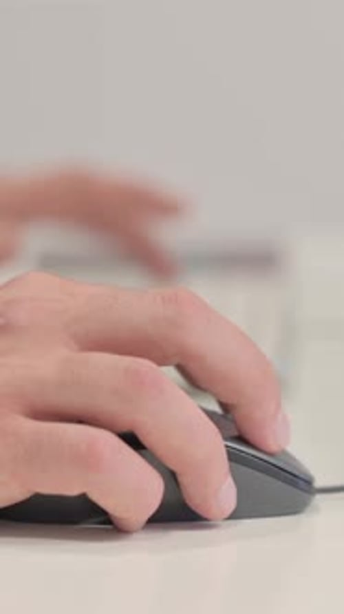 Close up of Male Hands Using Computer Mouse, vertical video