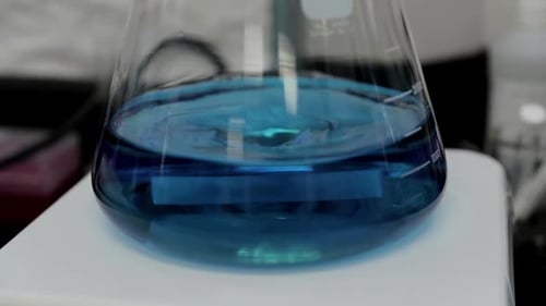 Science Beaker Mixing Unknown Liquid
