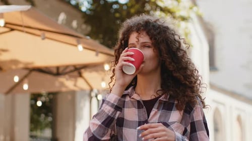 Happy Woman Girl Enjoying Drinking Morning Coffee Hot Drink Relaxing Taking a Break in City Street
