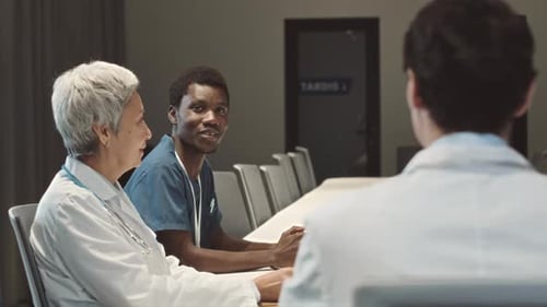 Medical Professionals Collaborate in Hospital Boardroom