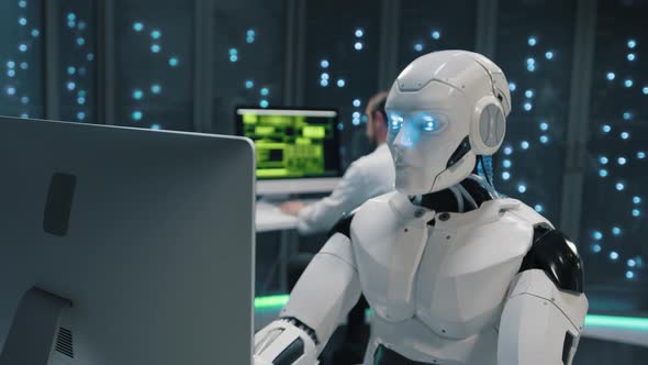 Futuristic Data Center Automated AI Cybernetic White Robot Keyboarding ...