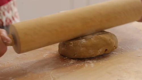 Using Rolling Pin to Roll Cookie Dough Baking