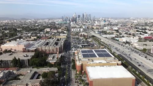Aerial forward view of highway to Los Angeles metropolis and skyline, USA