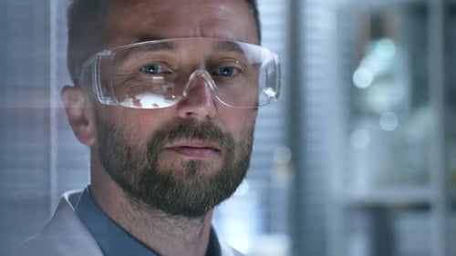 Portrait of Male Scientist in Protective Eyewear and Lab Coat
