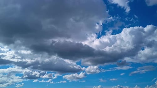 Clouds Moving Across Brilliant Blue Sky