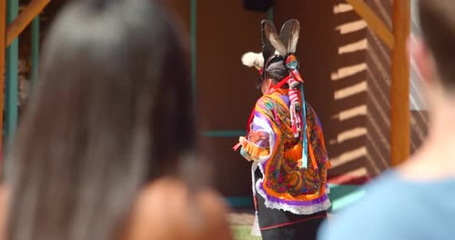 Taos pueblo native american dancers perform authentic show for tourists in New Mexico
