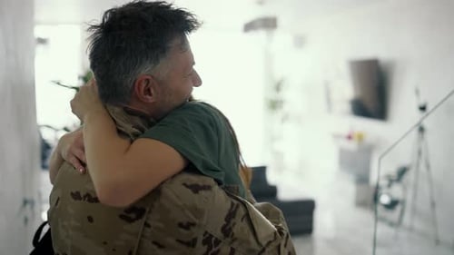 The Soldier Returns Home Happy Couple in Wartime Back View