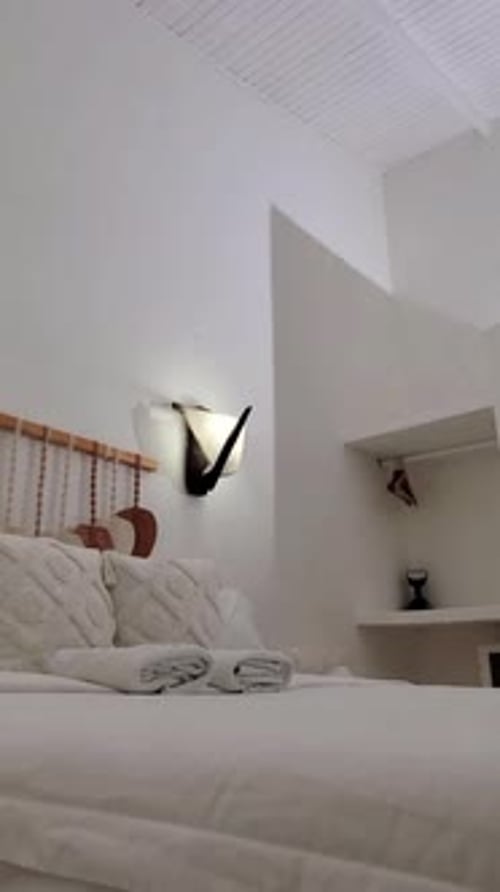 Contemporary chic Hotel Bed And White Linen. Pure white linen bed sheets textile decor