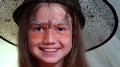 Smiling Girl Wearing Witch Costume Close Up