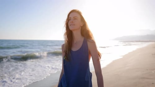 Attractive Woman Walking on the Beach