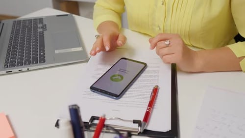 Close-up woman hand use cashless wifi app to buy online.