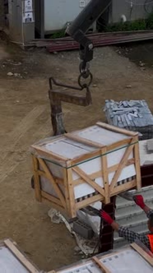 Vertical Video Aerial Construction Progression Crane Unloading Builders Advancing