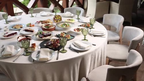 Festive banquet table in a restaurant. Served with delicious dishes.