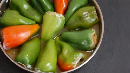Green and Red Stuffed Peppers in a Pan