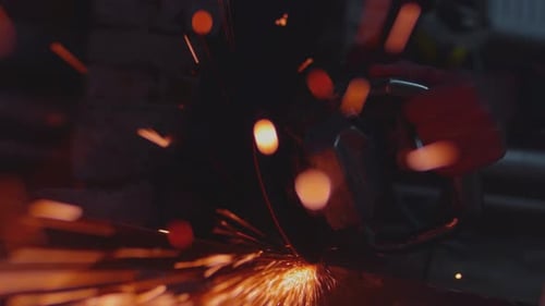 Cutting Angle Grinder Machine Cuts Metal Fly Close Up of Spinning Disk Tool with Flying Sparks
