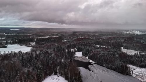 snow-covered forest and frozen river