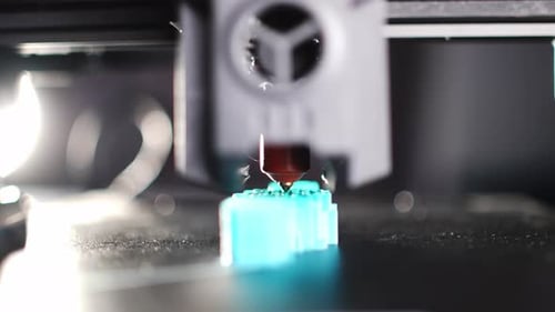 A Closeup of a Modern 3D Printer in the Process of Printing a Part