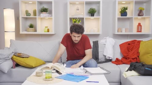 Young Adult Frustrated While Studying at Home