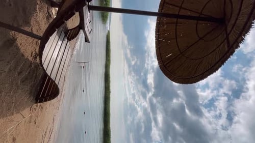 Empty Parasol and Chairs at the Beach