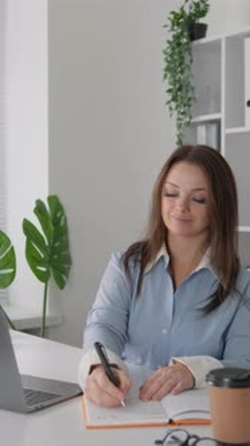 The Student is Deeply Immersed in the World of Online Learning Thanks to the Laptop She Has the