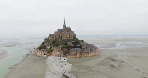 French Castle on a small island in France Le Mont Saint Michel Drone Shot In Normandy Typical Gothic
