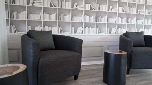 Cozy Sitting Room with Bookshelf Wallpaper