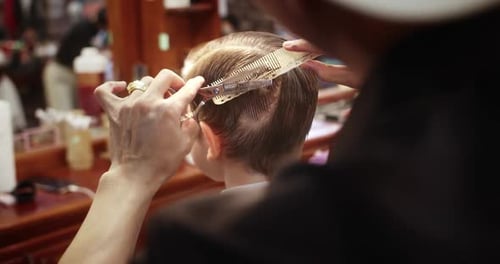 Child Getting Haircut at Barber Shop