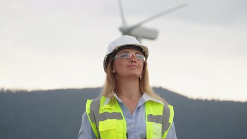 A Skilled Female Engineer is Successfully Managing a Challenging Wind Turbine Project Demonstrating