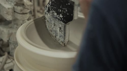 Artisan Shaping Clay Bowl on Rotating Wheel