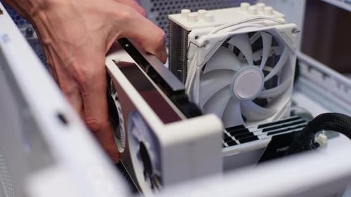 Closeup of Unrecognizable Master Repairman Assembling PC System Unit Install Video Card of Latest