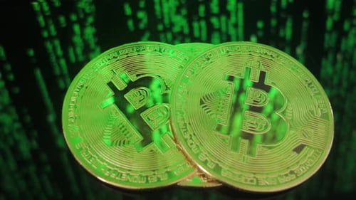 Digital Bitcoin Coins with Binary Code Background