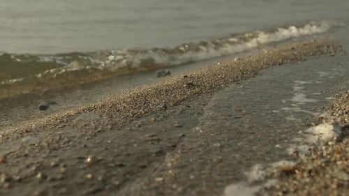 Gentle Waves Approaching The Beach Sand