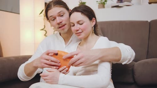 Affectionate Young Couple Taking Pictures with Instant Camera
