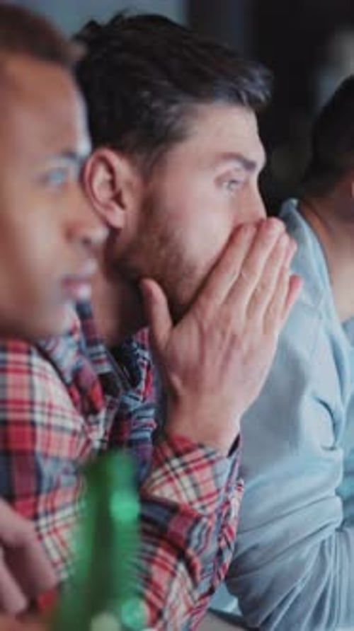 Side View of Stressful Multiethnic Guys Watching Serious TV Game Sport Show Football Match Getting