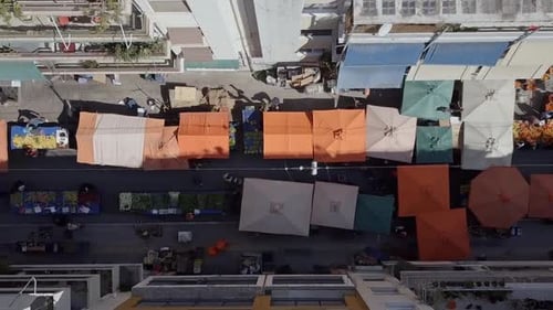 Drone shot looking down at vibrant street market Athens Greece