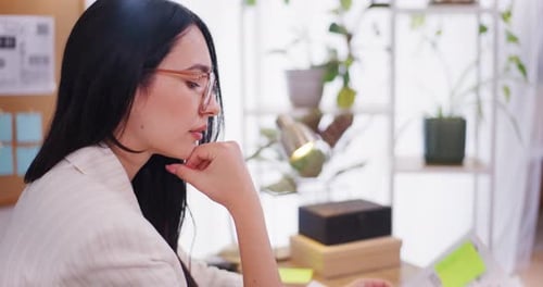 Woman Analyzes Data at Home Office Desk