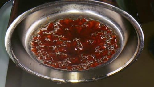 Espresso Dripping From Filter Close Up