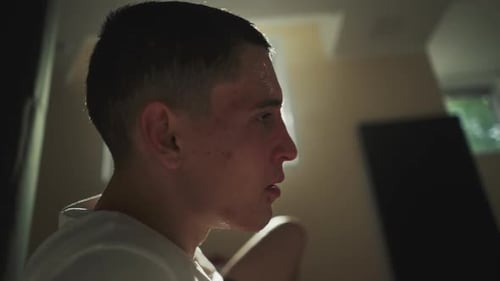 Young Adult Sweating After Intense Workout Indoors