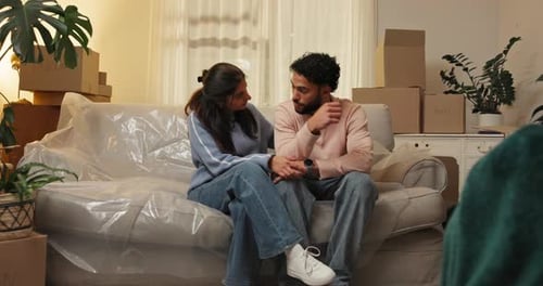 Couple, stress and support with boxes for eviction notice, move or home migration together